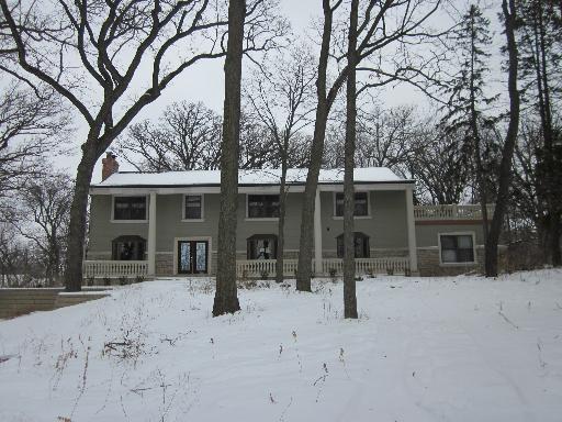 177 Dundee Road Barrington, IL 60010 - Photo 1 of 1 a front view of a house with a yard covered in snow