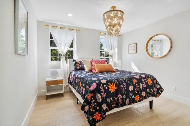 a bedroom with bed and a window