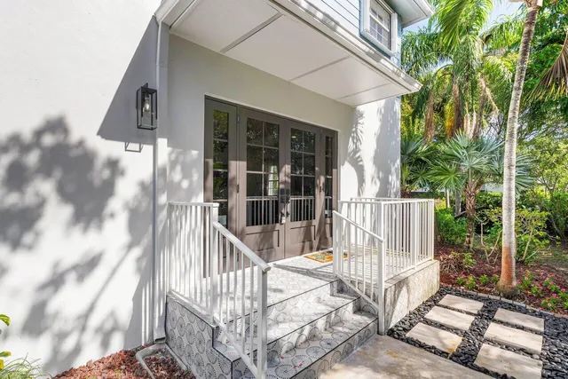 a view of staircase with white walls and windows