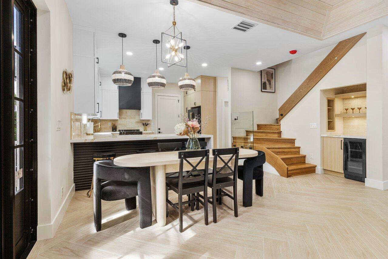 1920 Spanish Trail Delray Beach, FL 33483 - Photo 7 of 23 a view of a dining room with furniture