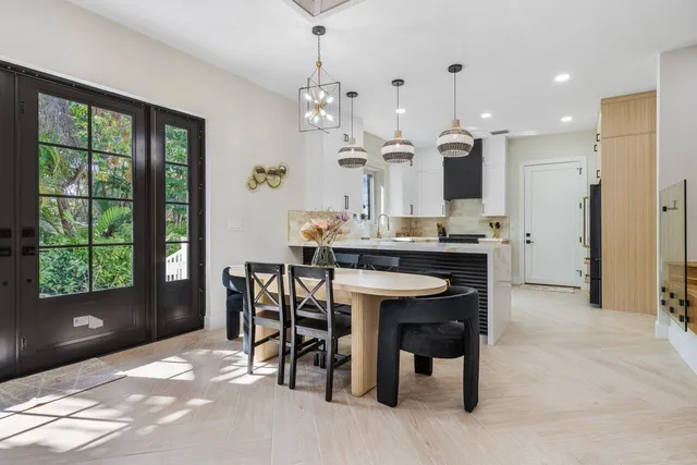 a kitchen with a table and chairs in it