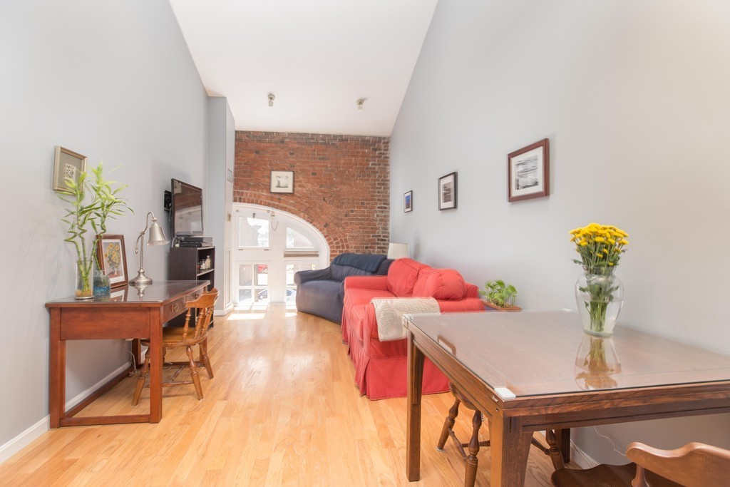 106 13th Street, Unit 204 Boston, MA 02129 - Photo 2 of 21 a living room with furniture and wooden floor