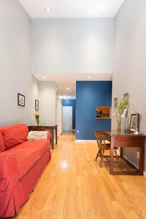 106 13th Street, Unit 204 Boston, MA 02129 - Photo 3 of 21 a living room with furniture and wooden floor