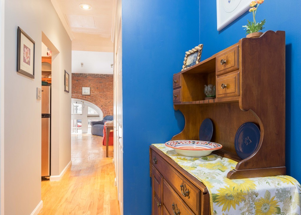 106 13th Street, Unit 204 Boston, MA 02129 - Photo 6 of 21 a bathroom with a sink a mirror and vanity