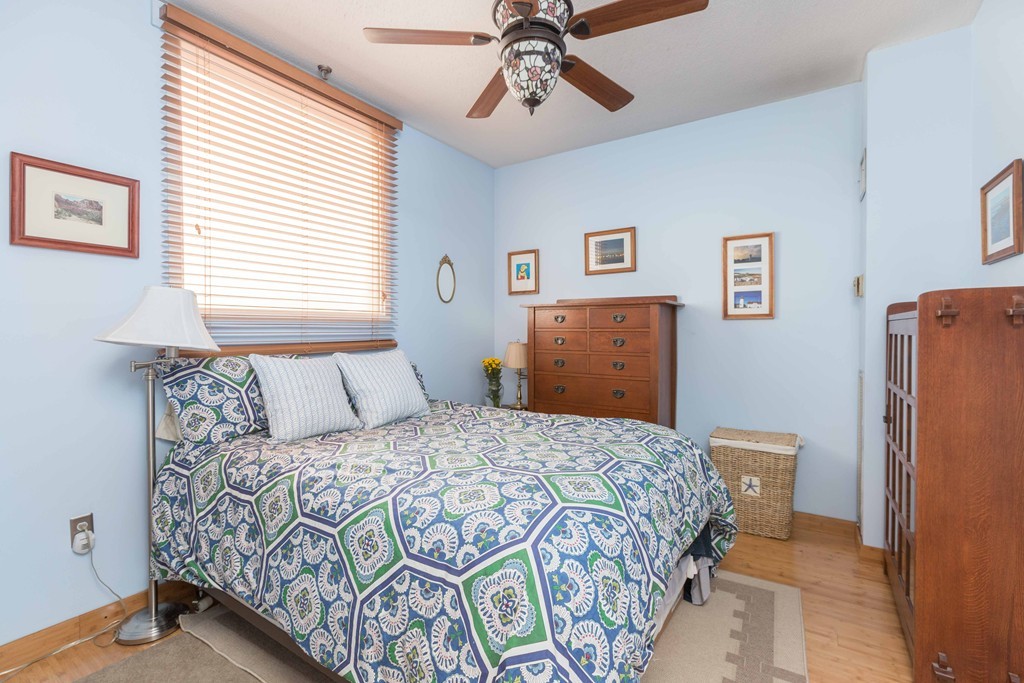 106 13th Street, Unit 204 Boston, MA 02129 - Photo 10 of 21 a bedroom with a bed and a dresser