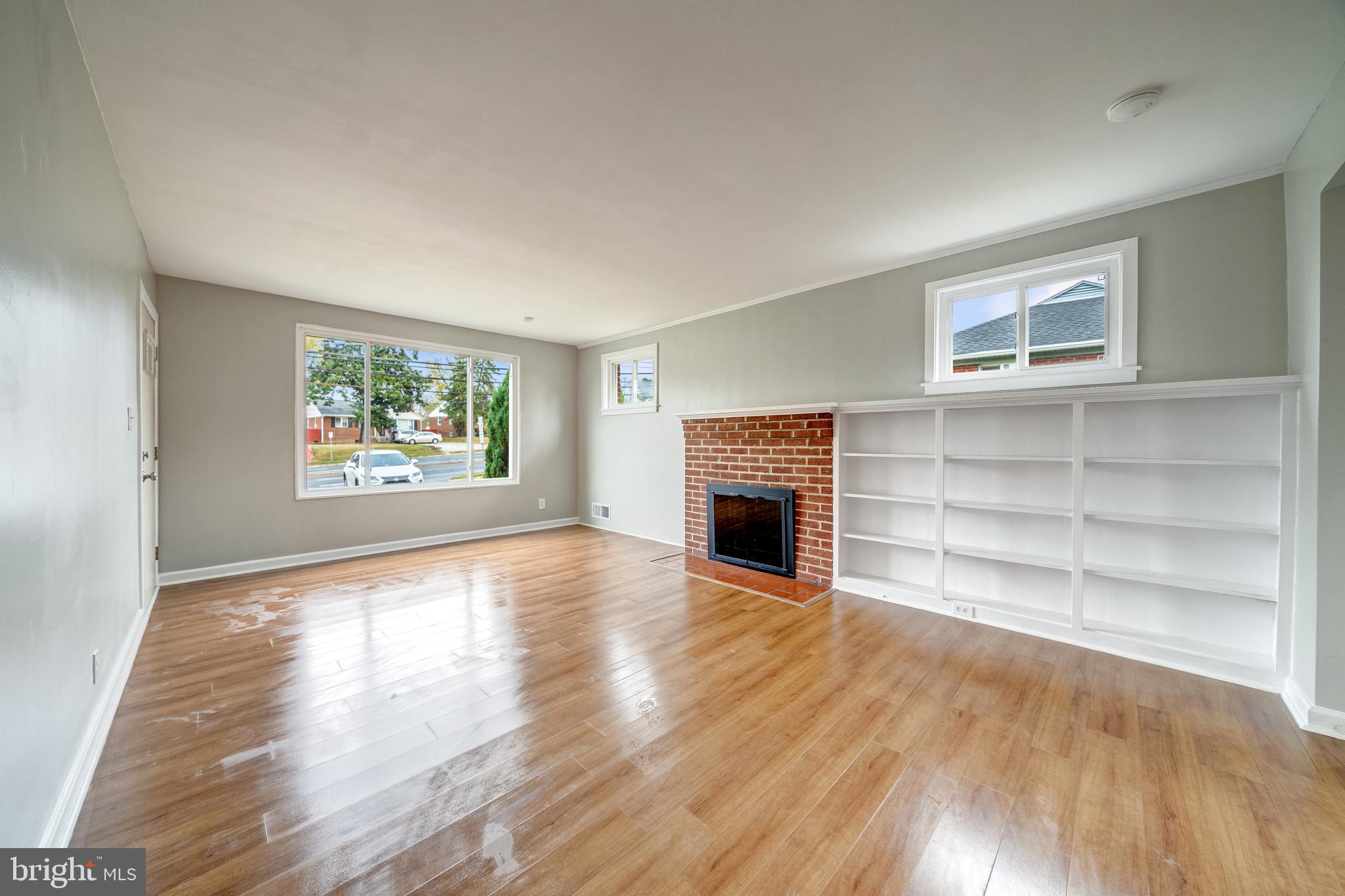 3614 Randolph Road Silver Spring, MD 20902 - Photo 6 of 39 a view of empty room with wooden floor and fireplace