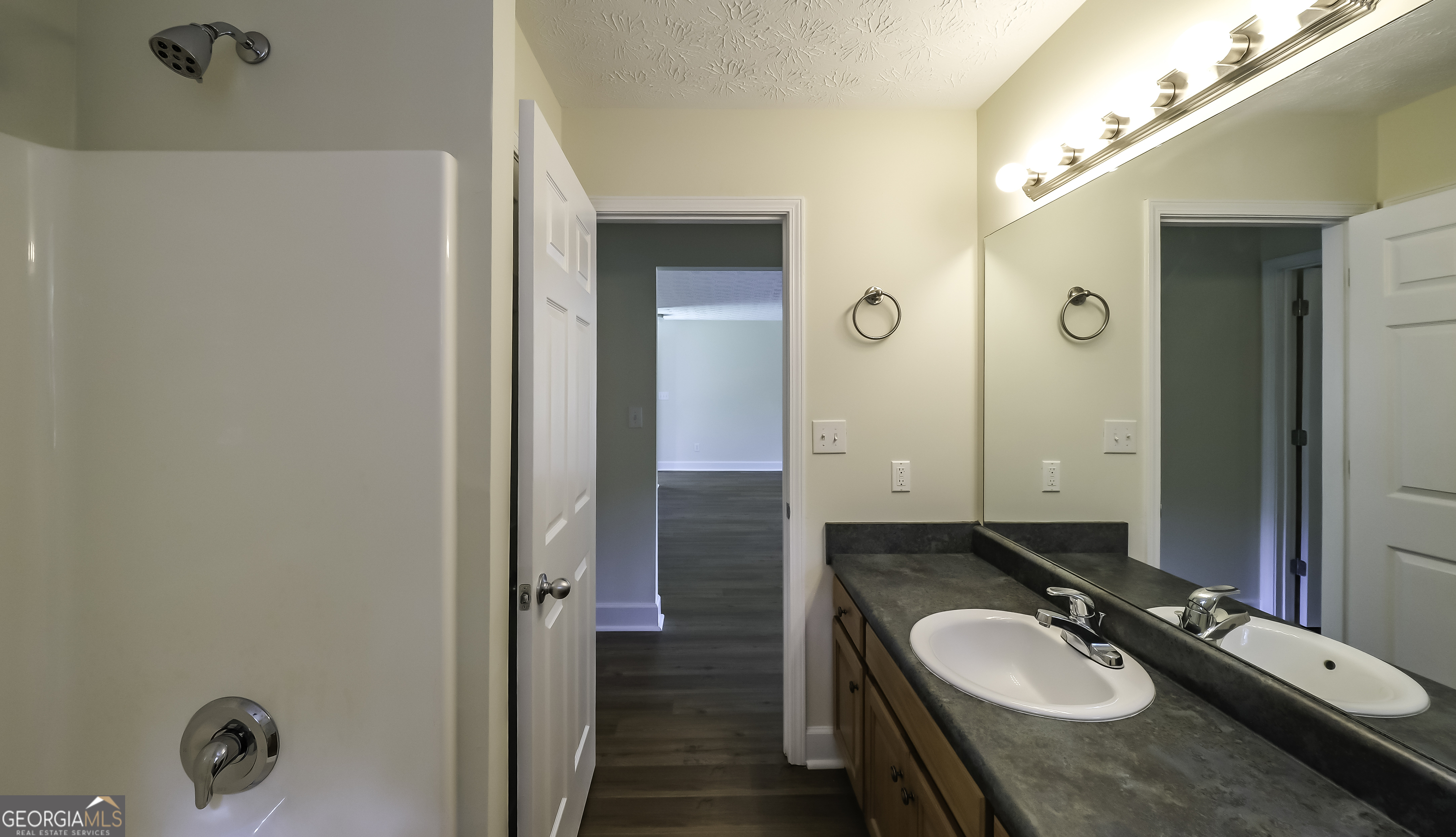 191 Tumlin Creek Road Roopville, GA 30170 - Photo 23 of 49 a bathroom with a granite countertop sink and a mirror