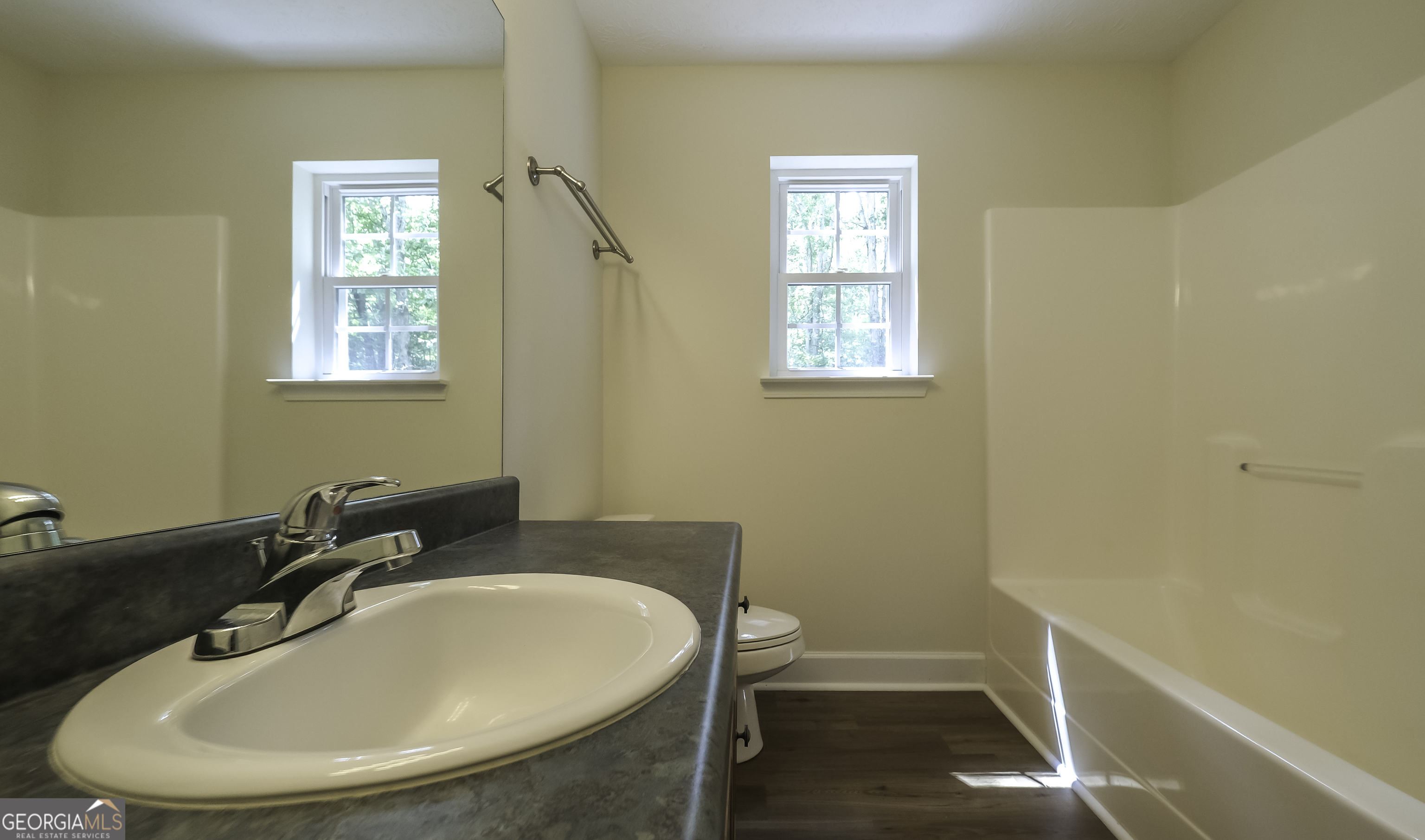 191 Tumlin Creek Road Roopville, GA 30170 - Photo 24 of 49 a bathroom with a sink and a toilet
