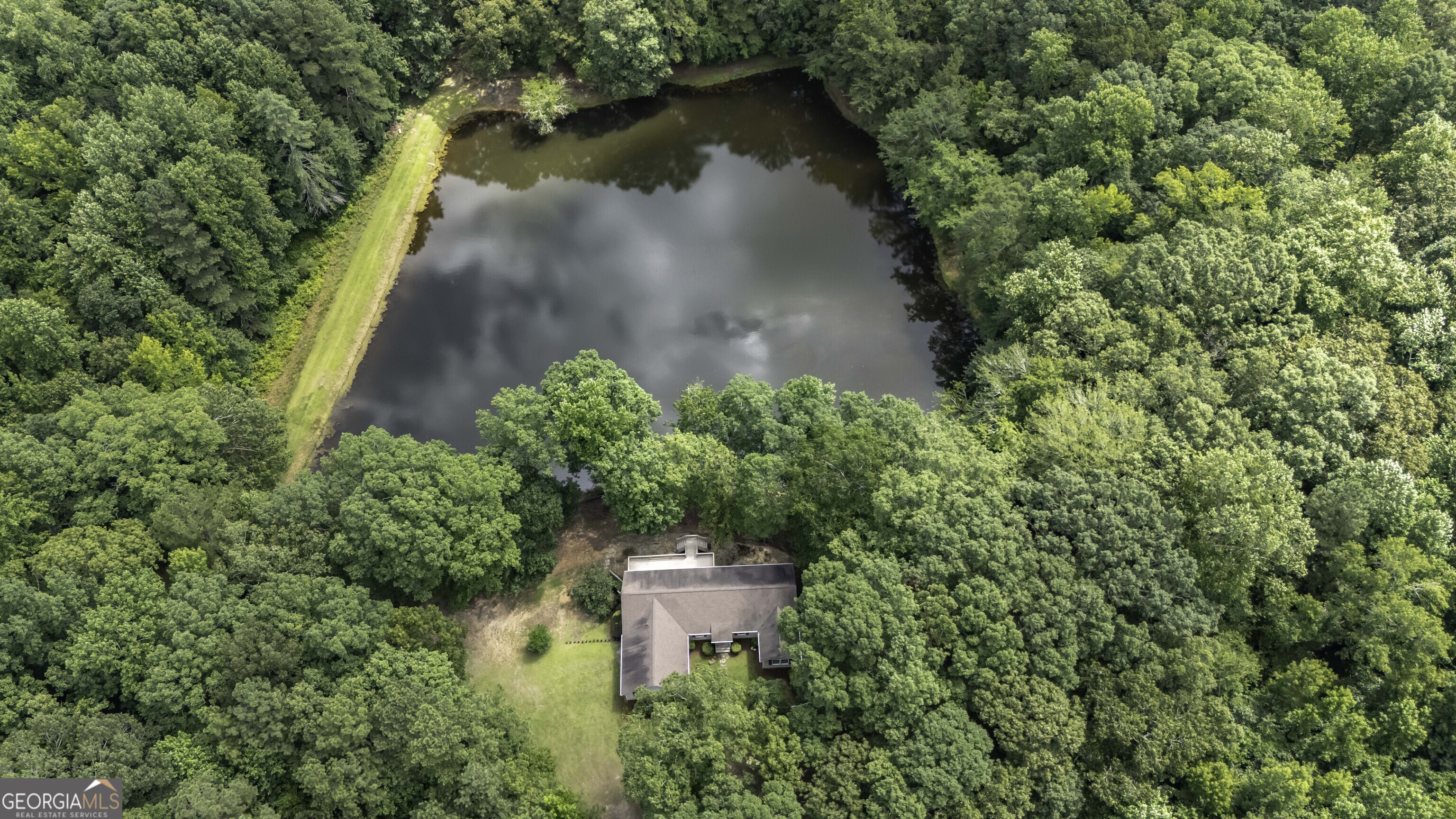 191 Tumlin Creek Road Roopville, GA 30170 - Photo 35 of 49 an aerial view of a house with a yard and lake view