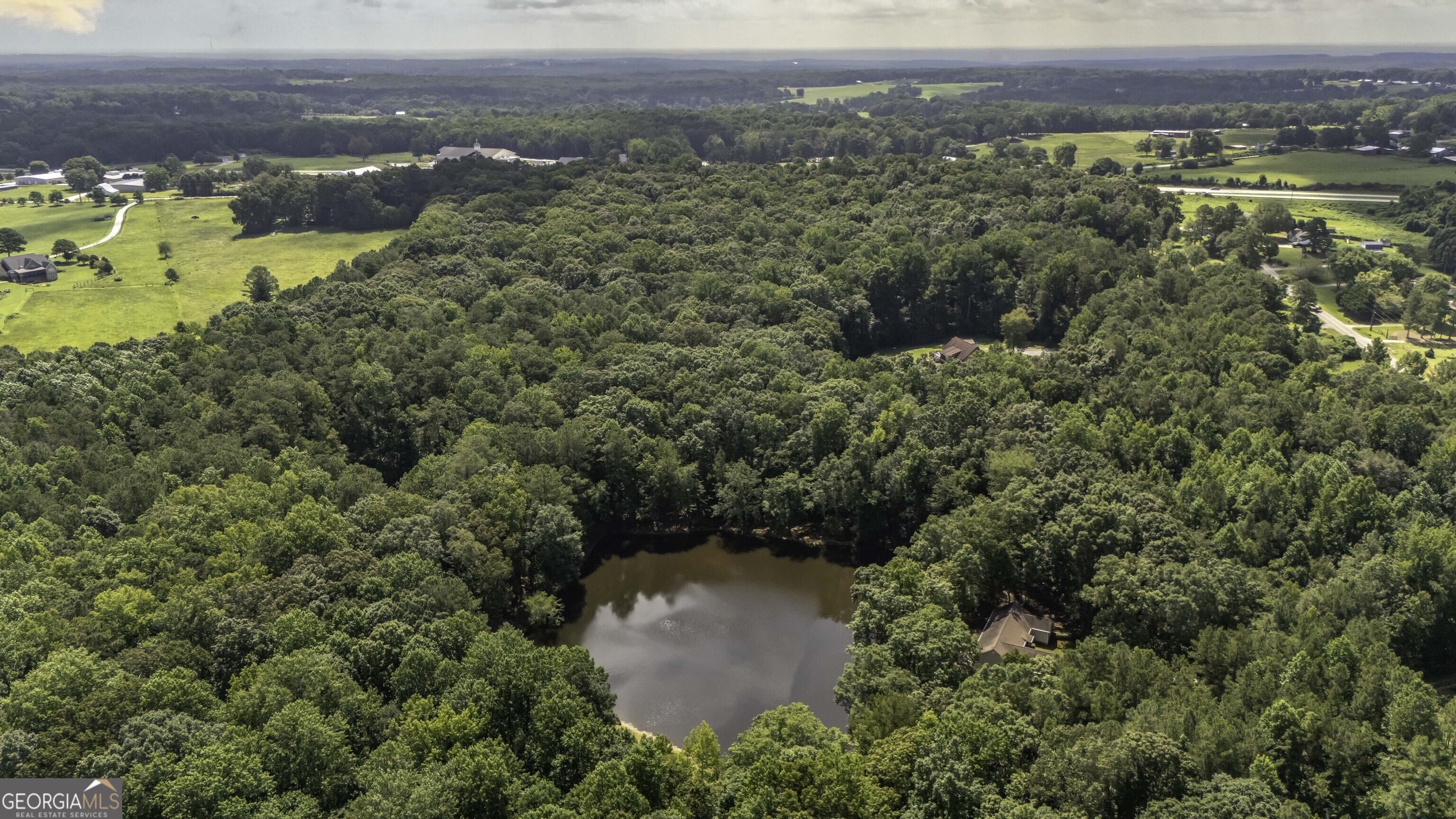 191 Tumlin Creek Road Roopville, GA 30170 - Photo 37 of 49 an aerial view of houses with a lake view