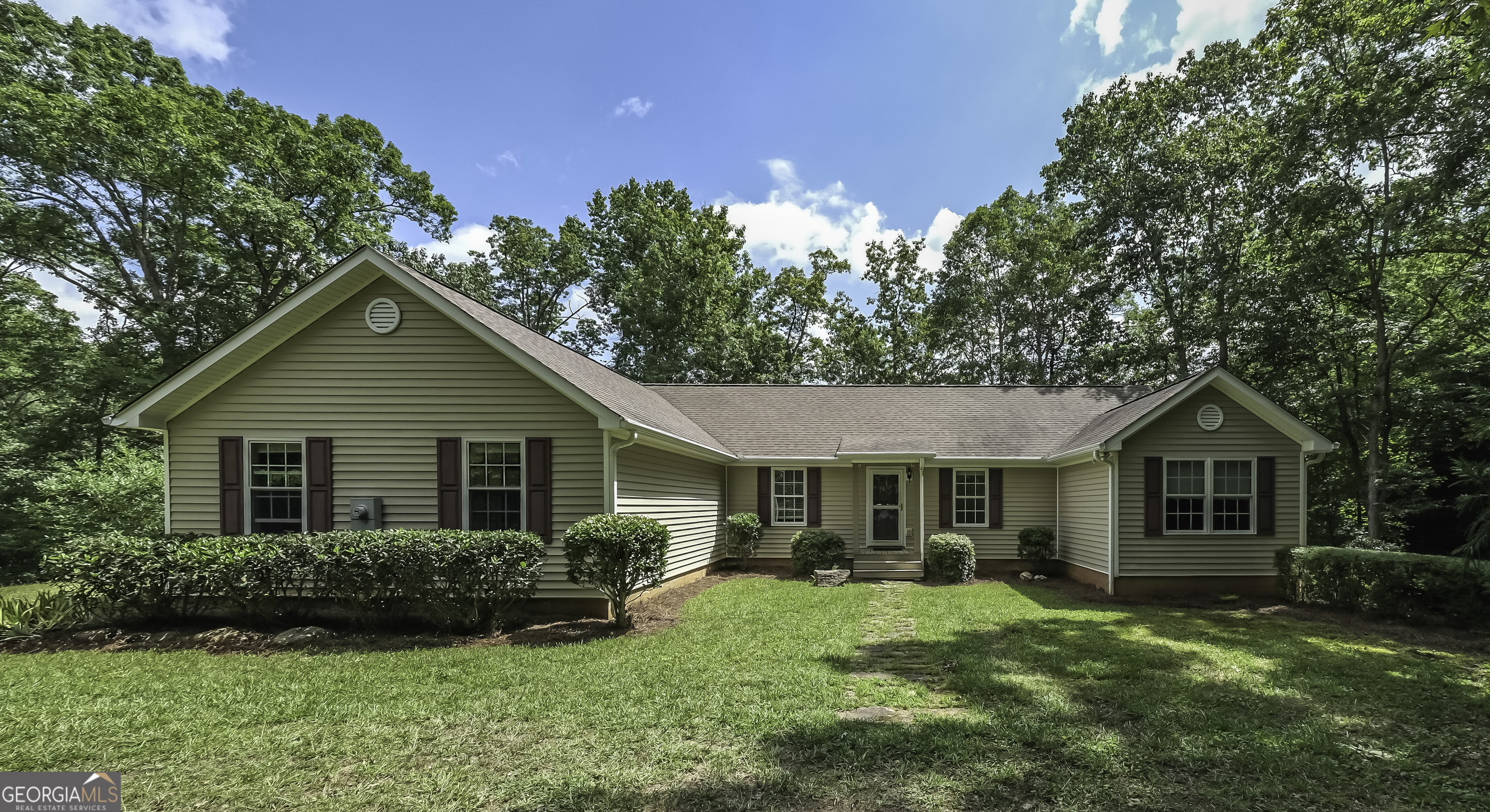 191 Tumlin Creek Road Roopville, GA 30170 - Photo 4 of 49 a front view of a house with a yard and porch