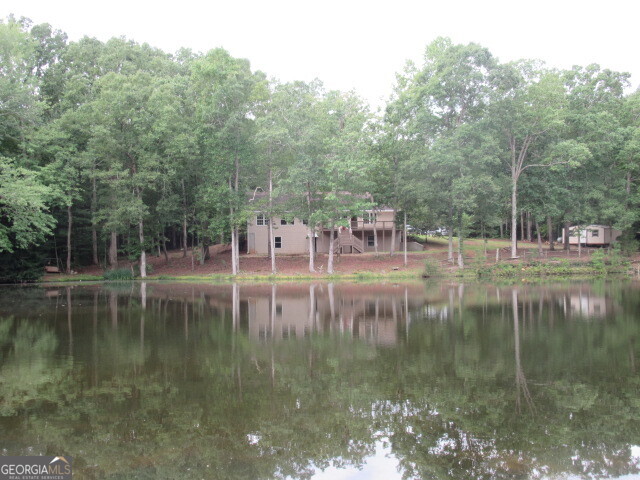 191 Tumlin Creek Road Roopville, GA 30170 - Photo 47 of 49 a lake view with large trees
