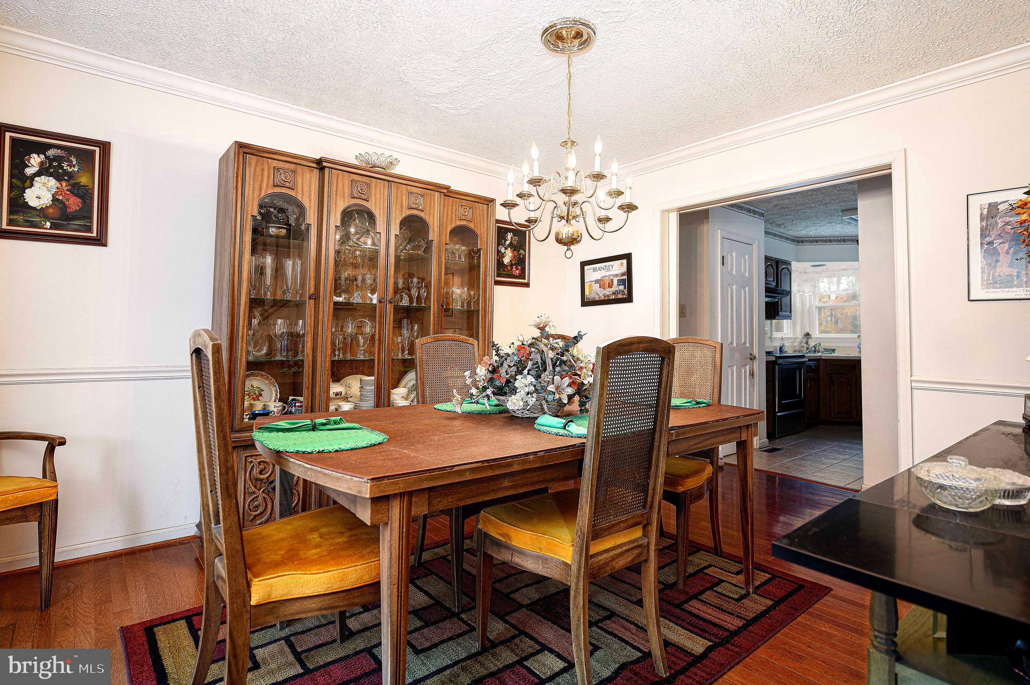 1415 Valley Forge Way Abingdon, MD 21009 - Photo 11 of 35 a view of a dining room with furniture and chandelier