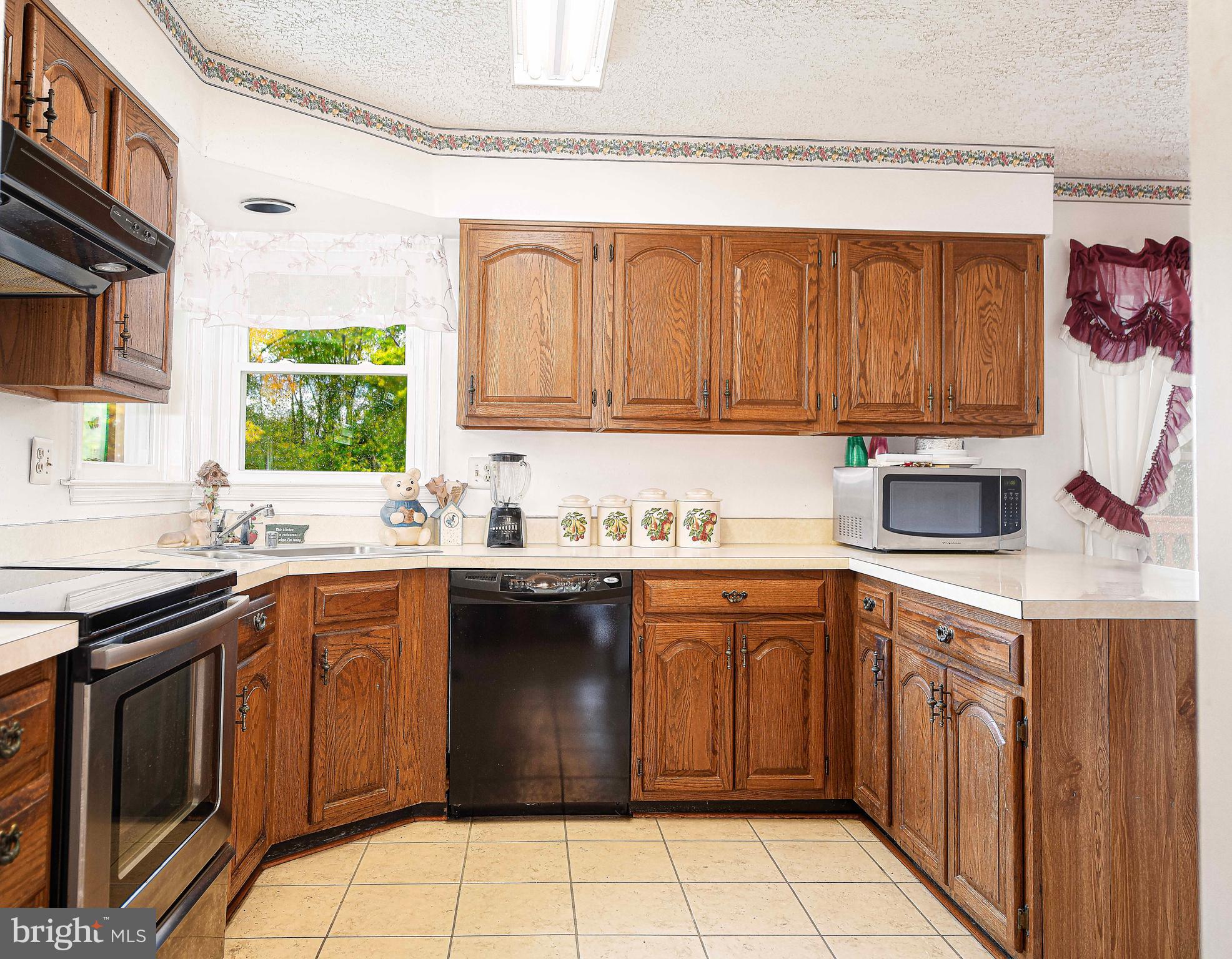 1415 Valley Forge Way Abingdon, MD 21009 - Photo 12 of 35 a kitchen with a sink stove top oven and cabinets