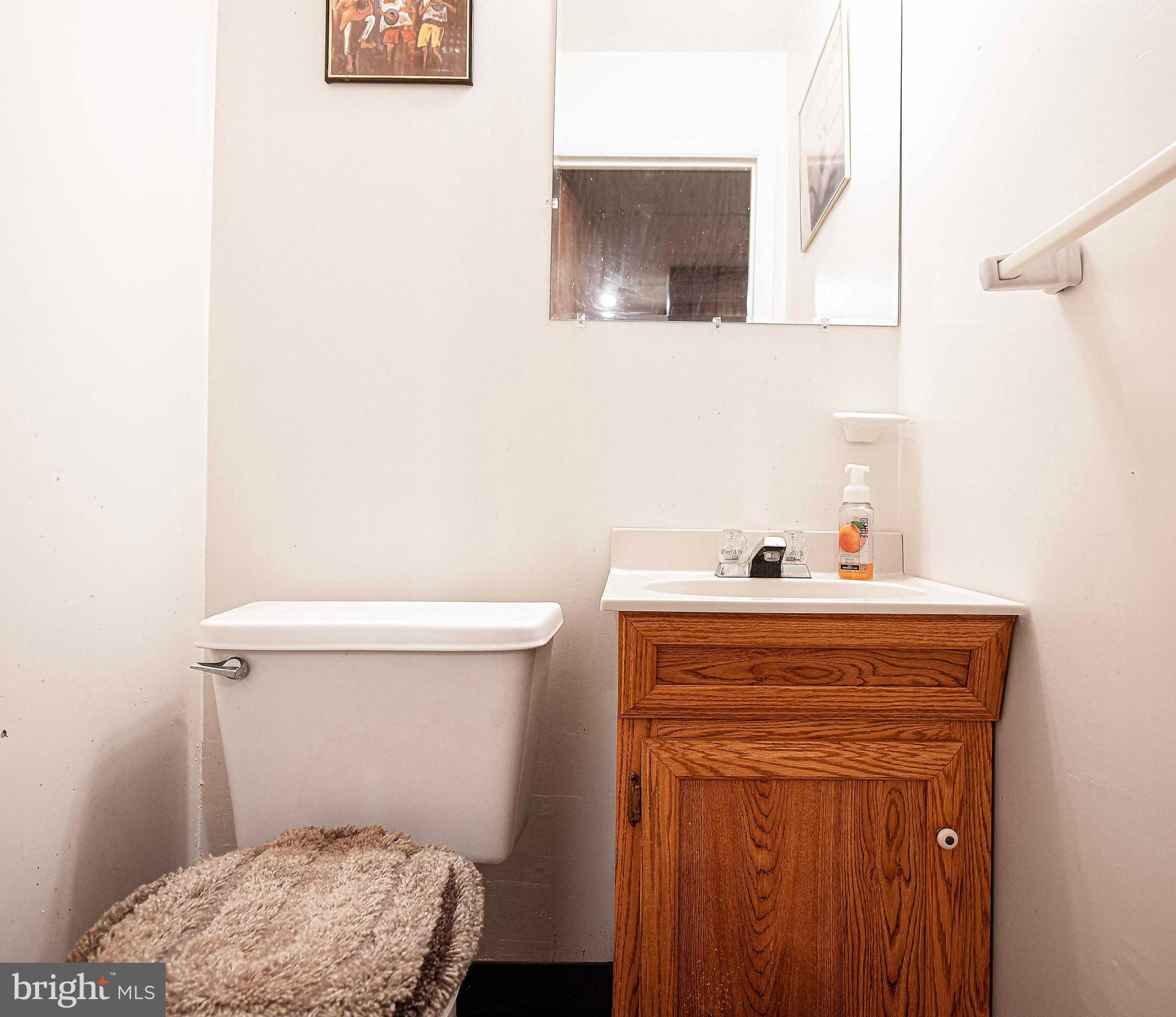 1415 Valley Forge Way Abingdon, MD 21009 - Photo 16 of 35 a bathroom with a sink a toilet and vanity