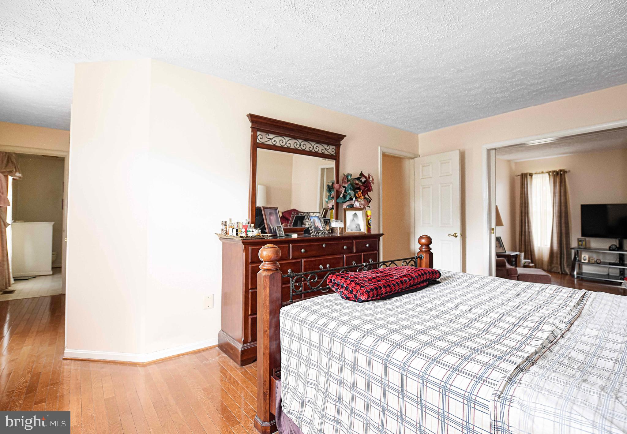 1415 Valley Forge Way Abingdon, MD 21009 - Photo 17 of 35 a bedroom with a bed and a large mirror on the dresser