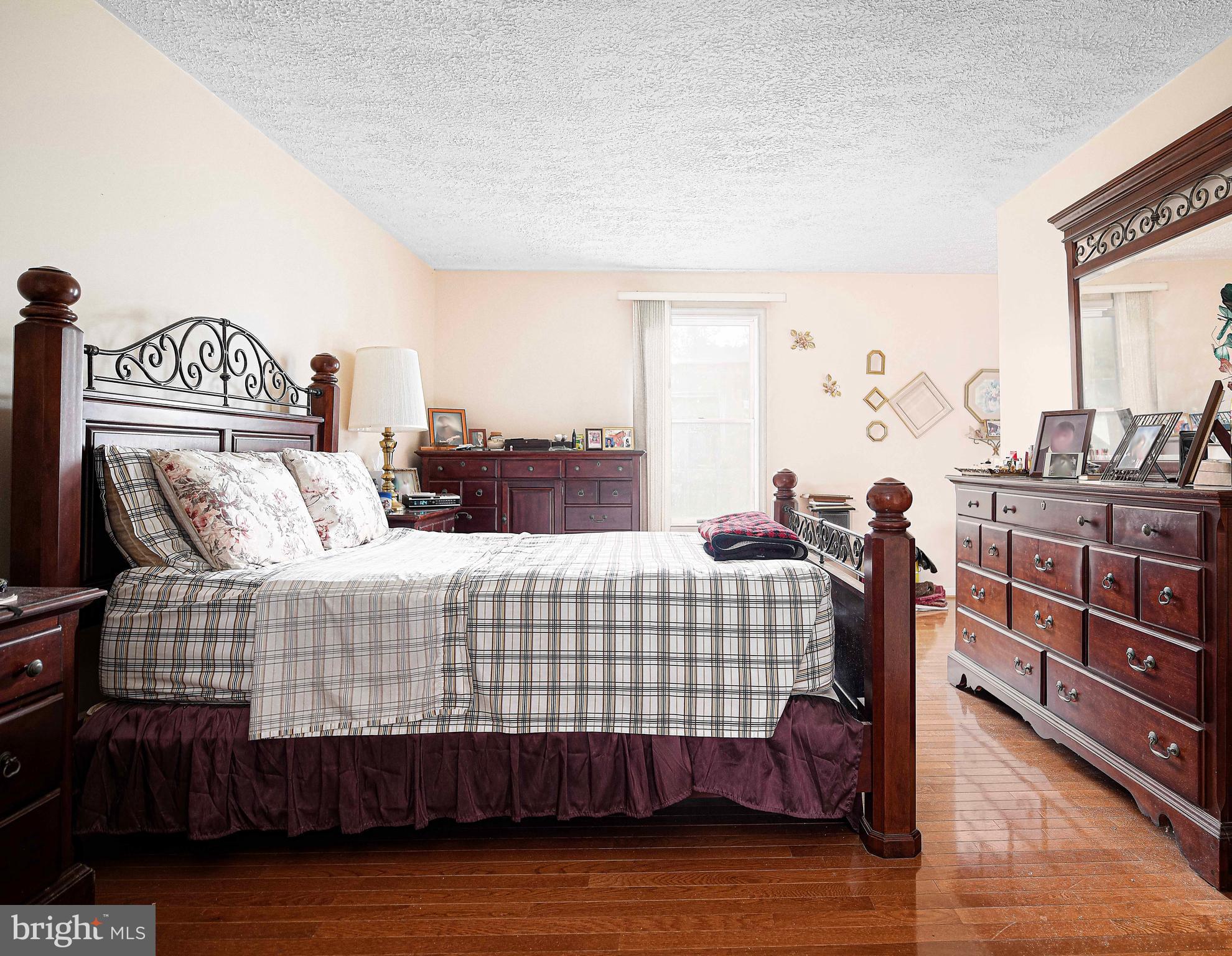 1415 Valley Forge Way Abingdon, MD 21009 - Photo 19 of 35 a bedroom with a bed and wooden floor