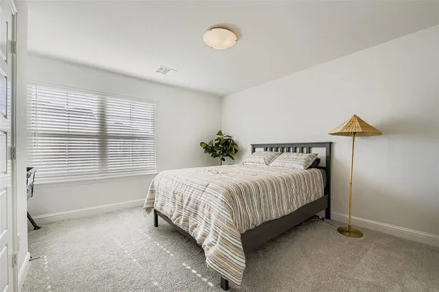 a room with a bed and a window