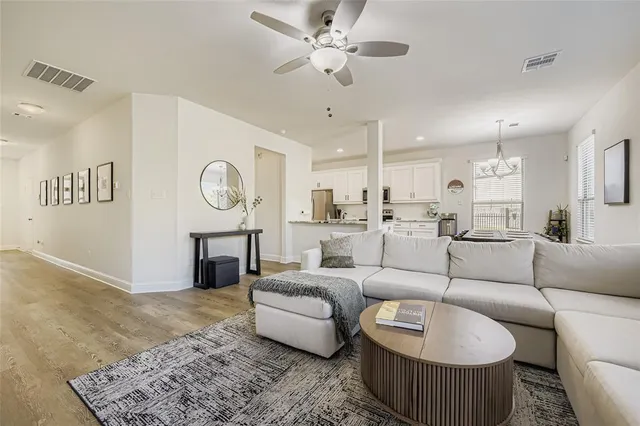 a living room with furniture and a clock