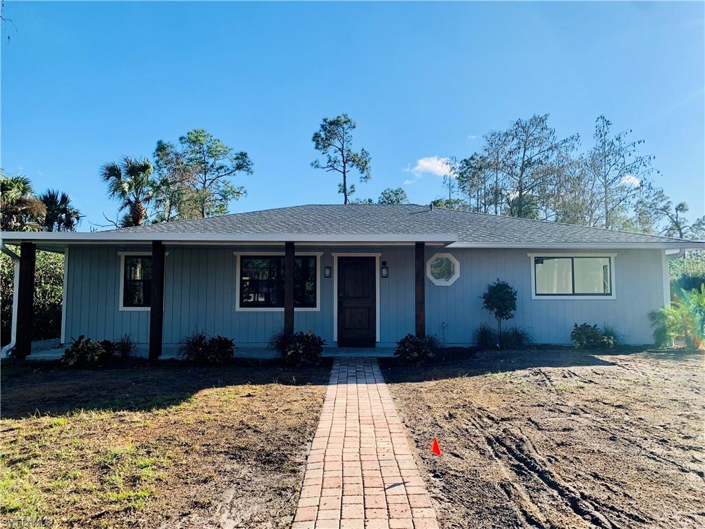 4180 5th Avenue Southwest Naples, FL 34119 - Photo 1 of 33 a front view of a house