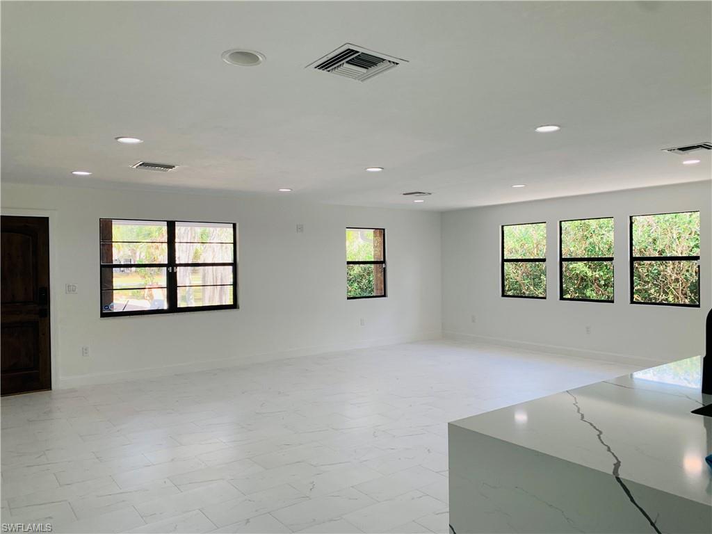 4180 5th Avenue Southwest Naples, FL 34119 - Photo 11 of 33 a view of an empty room with a window