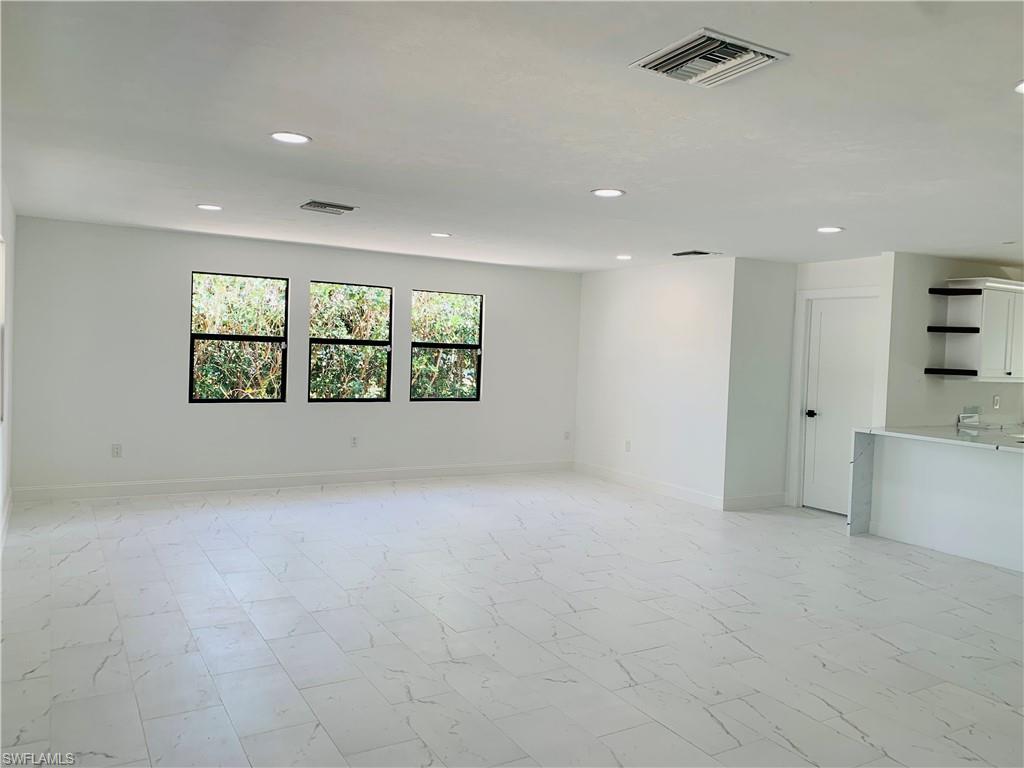 4180 5th Avenue Southwest Naples, FL 34119 - Photo 12 of 33 an empty room with windows and closet