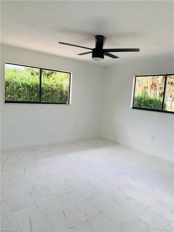 4180 5th Avenue Southwest Naples, FL 34119 - Photo 17 of 33 an empty room with windows