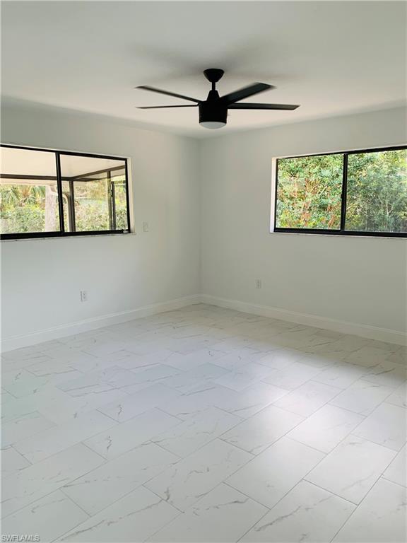 4180 5th Avenue Southwest Naples, FL 34119 - Photo 23 of 33 a view of an empty room with a window