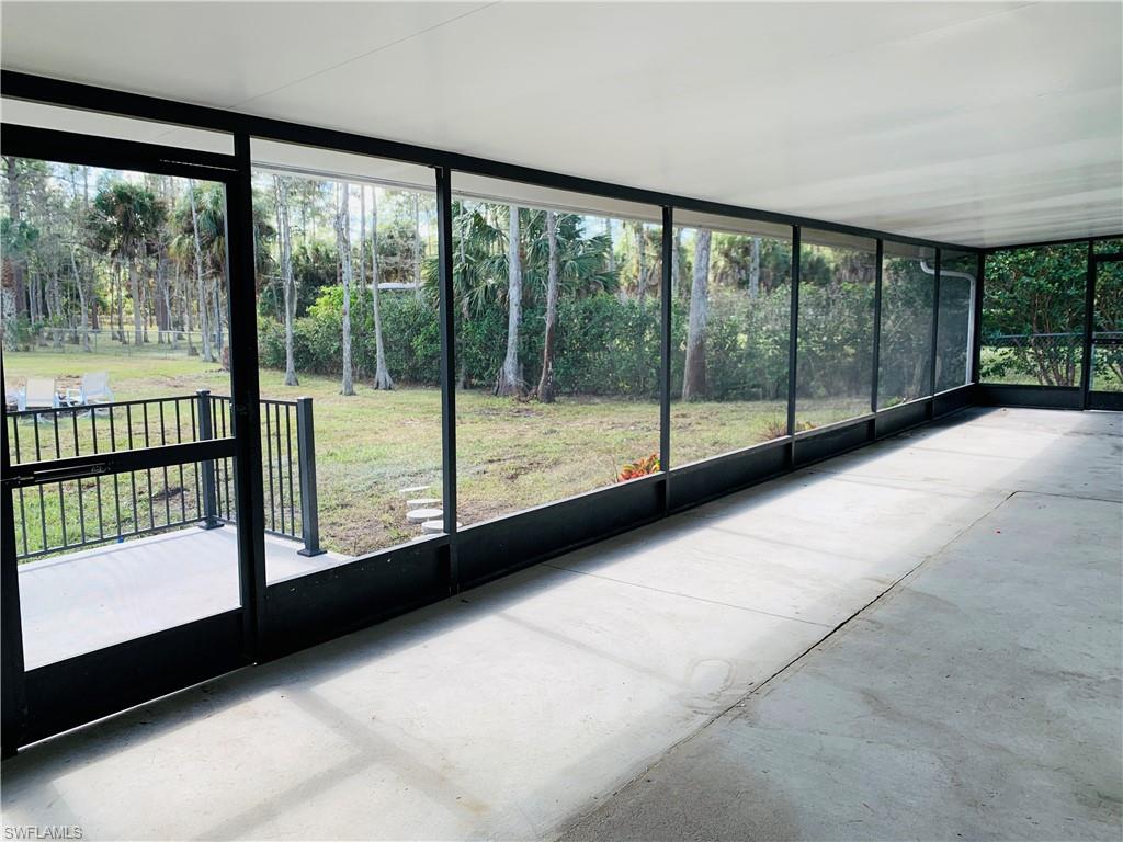 4180 5th Avenue Southwest Naples, FL 34119 - Photo 29 of 33 a view of empty room with large windows