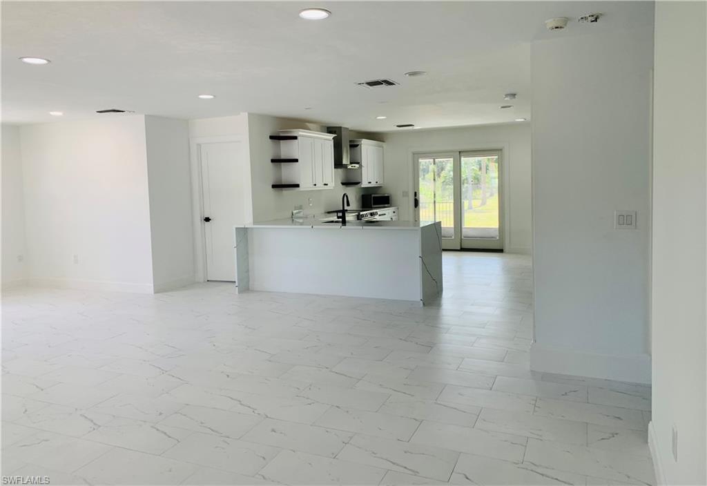 4180 5th Avenue Southwest Naples, FL 34119 - Photo 5 of 33 a view of kitchen with furniture and window