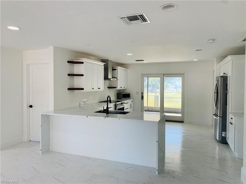 4180 5th Avenue Southwest Naples, FL 34119 - Photo 6 of 33 a view of kitchen with furniture and a window