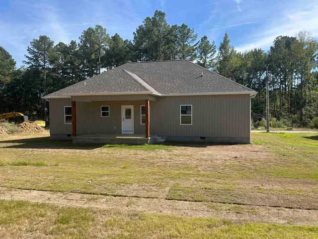 a house with trees in the background