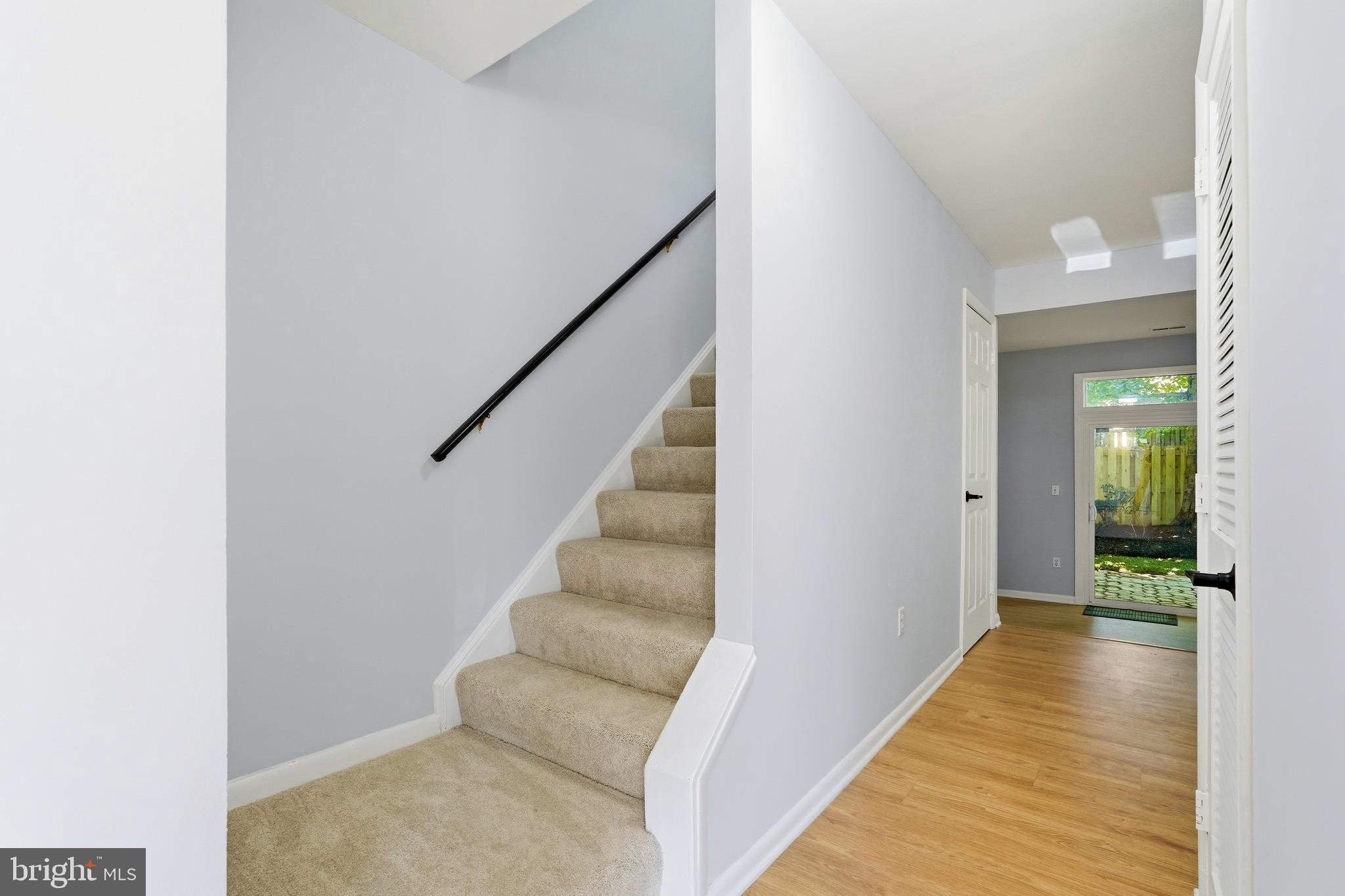 3682 Masthead Trail Triangle, VA 22172 - Photo 7 of 53 a view of a hallway with wooden floor and staircase