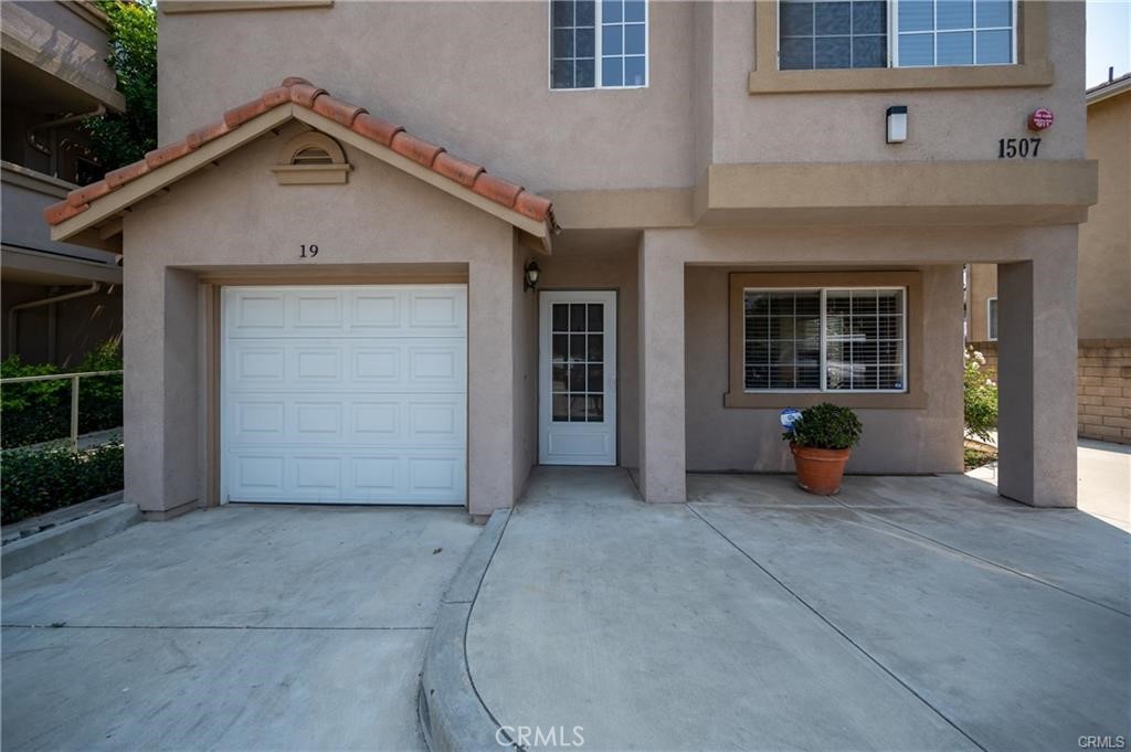 1507 Spruce Street, Unit A Placentia, CA 92870 - Photo 1 of 4 a view of a house with an empty space and garage