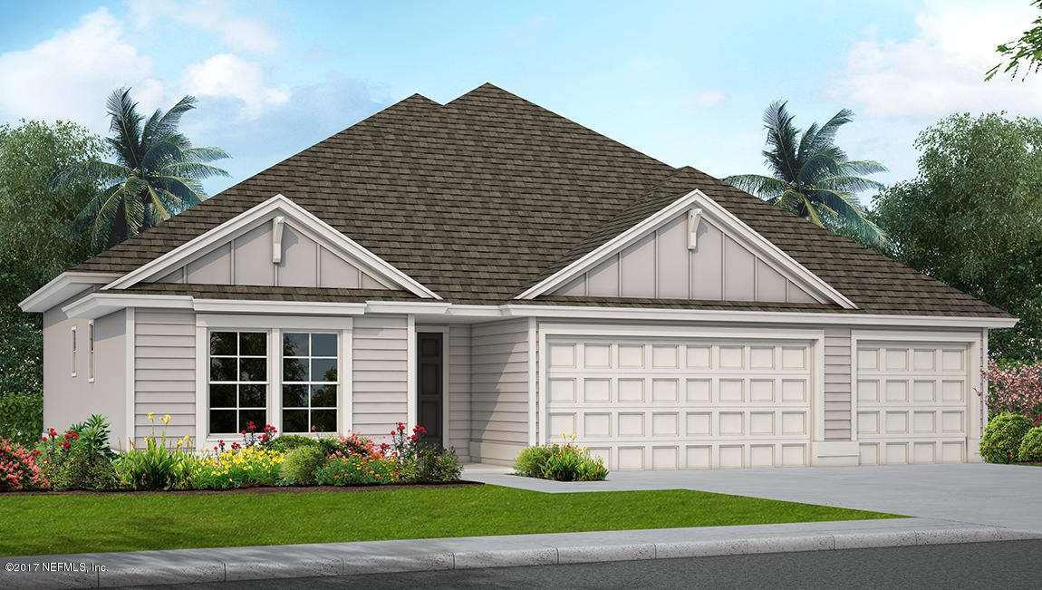 370 Deer Crossing Road St. Augustine, FL 32086 - Photo 1 of 5 a front view of a house with a garden and plants
