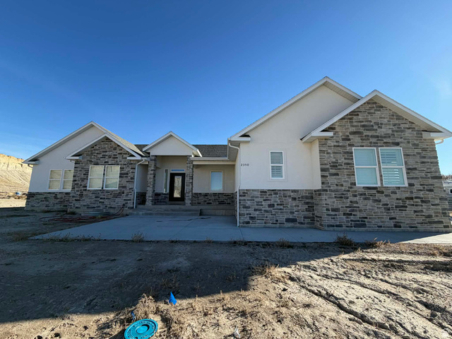 2350 North 1075 West Helper, UT 84526 - Photo 2 of 49 View of front of house with stucco siding and stone siding