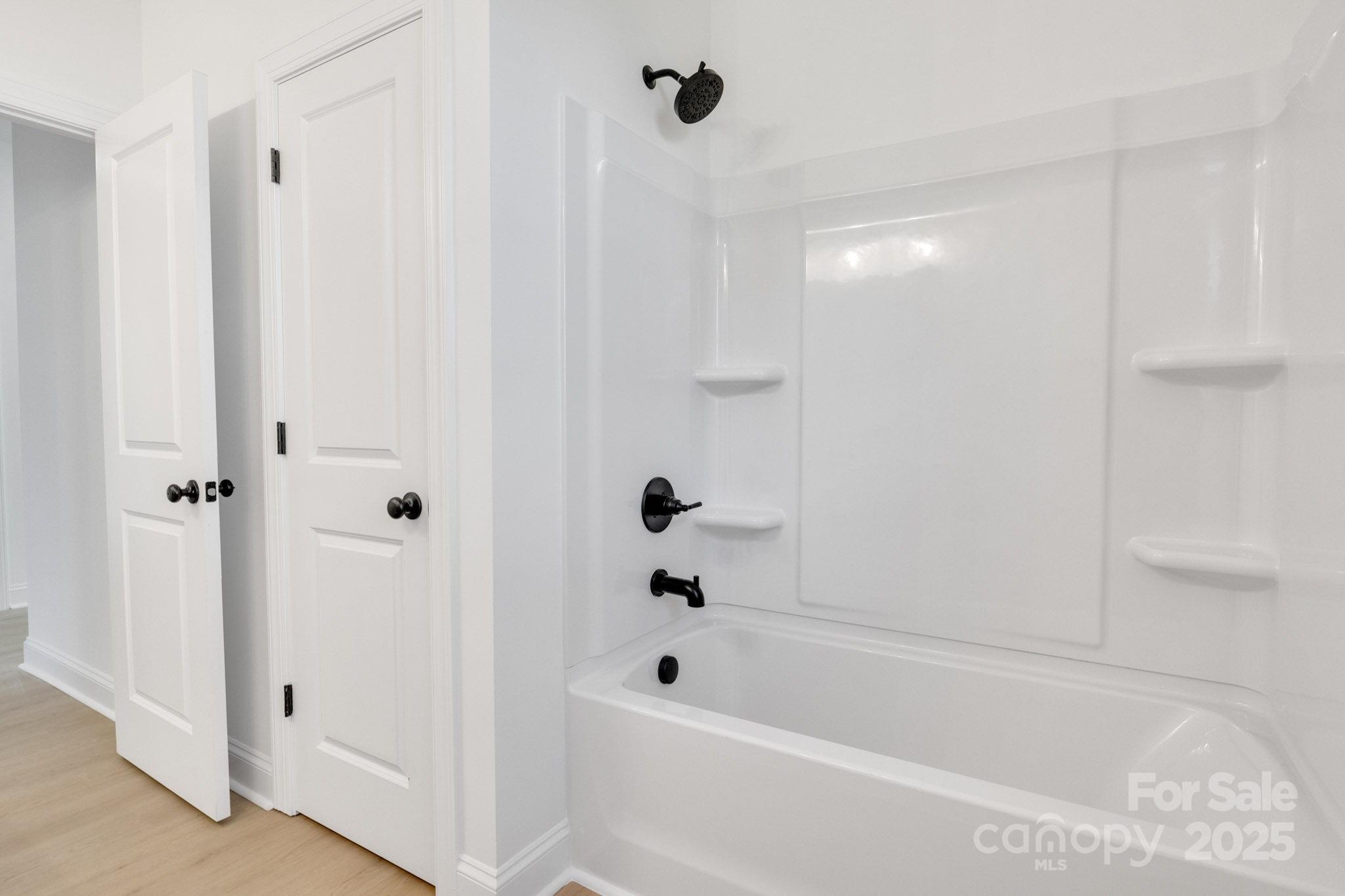 540 Church Street Locust, NC 28097 - Photo 16 of 25 a bathroom with a bathtub