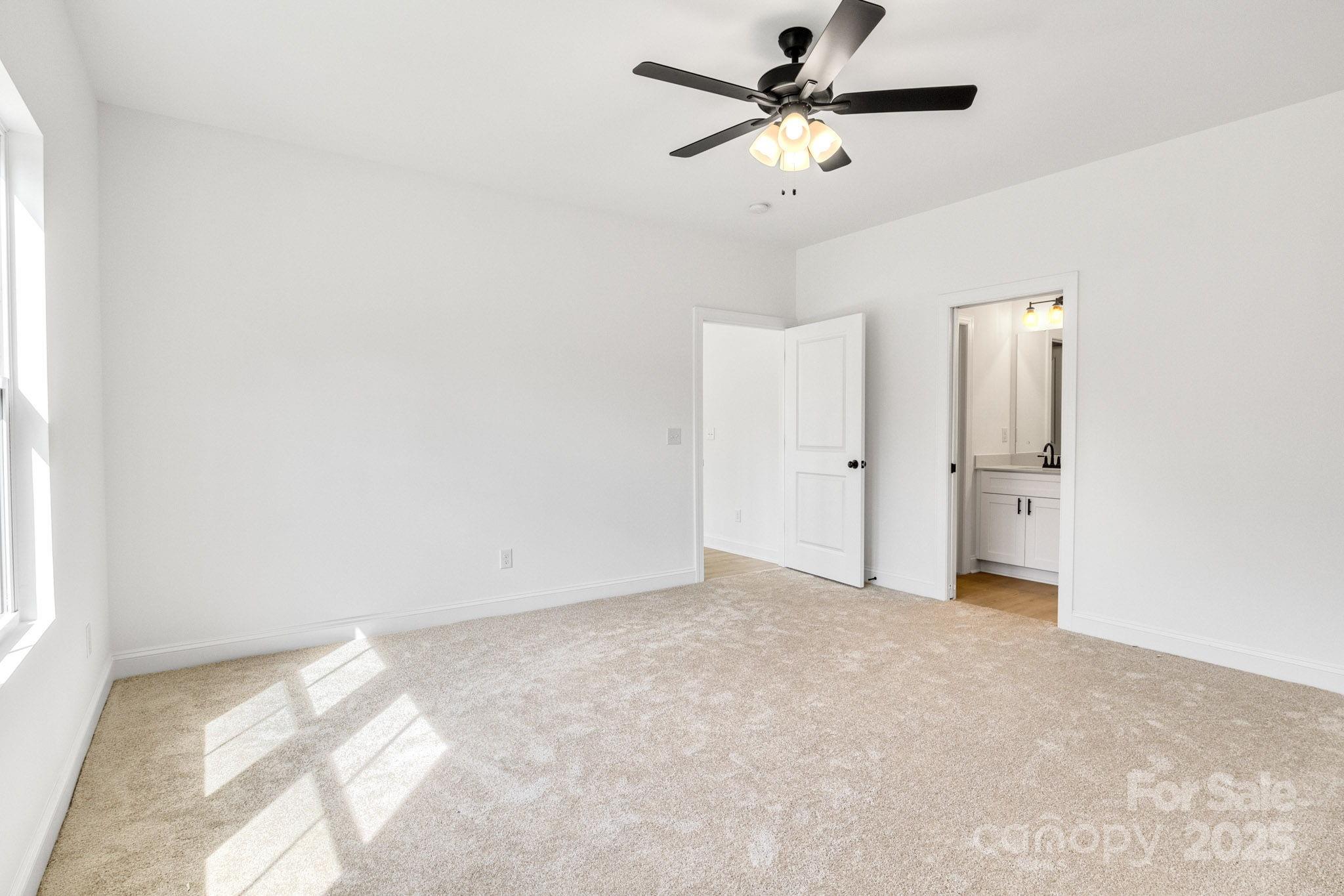 540 Church Street Locust, NC 28097 - Photo 18 of 25 a view of empty room with a ceiling fan