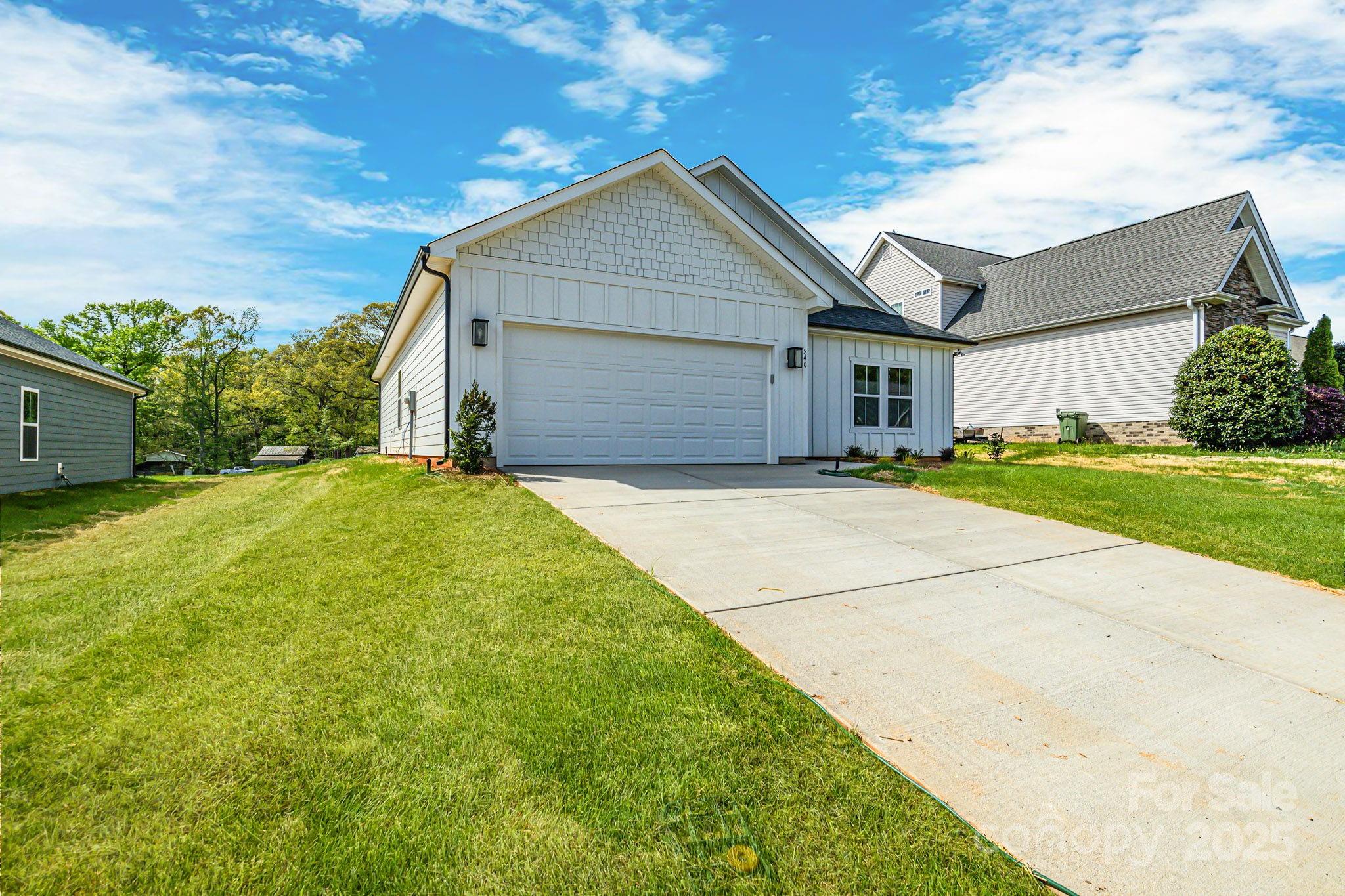 540 Church Street Locust, NC 28097 - Photo 2 of 25 a view of a house with a yard