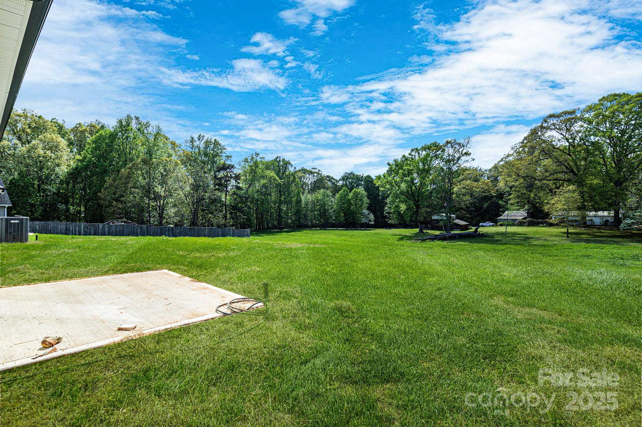540 Church Street Locust, NC 28097 - Photo 22 of 25 a view of a field of grass and trees
