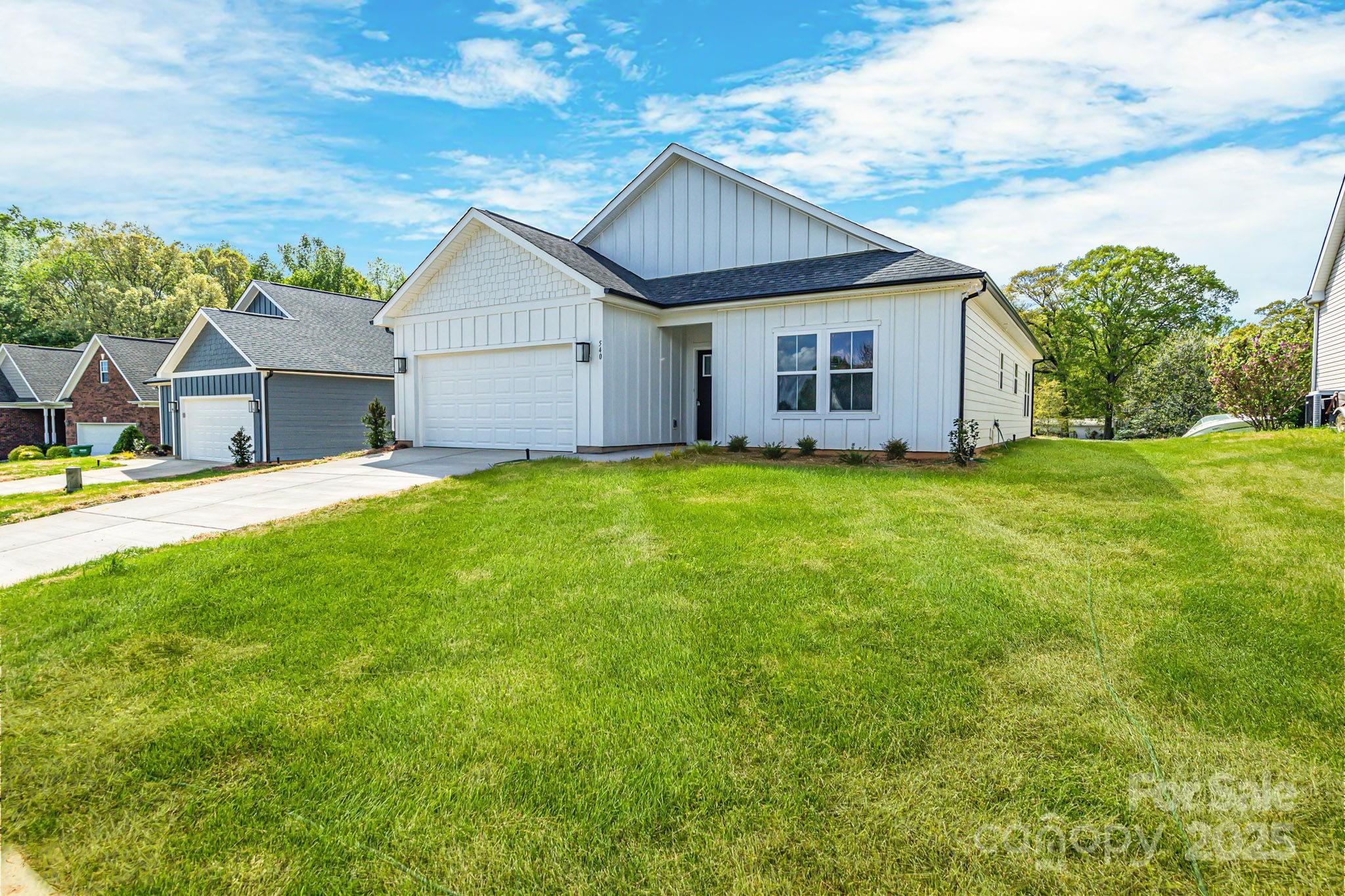 540 Church Street Locust, NC 28097 - Photo 3 of 25 a view of a house with a yard and pathway