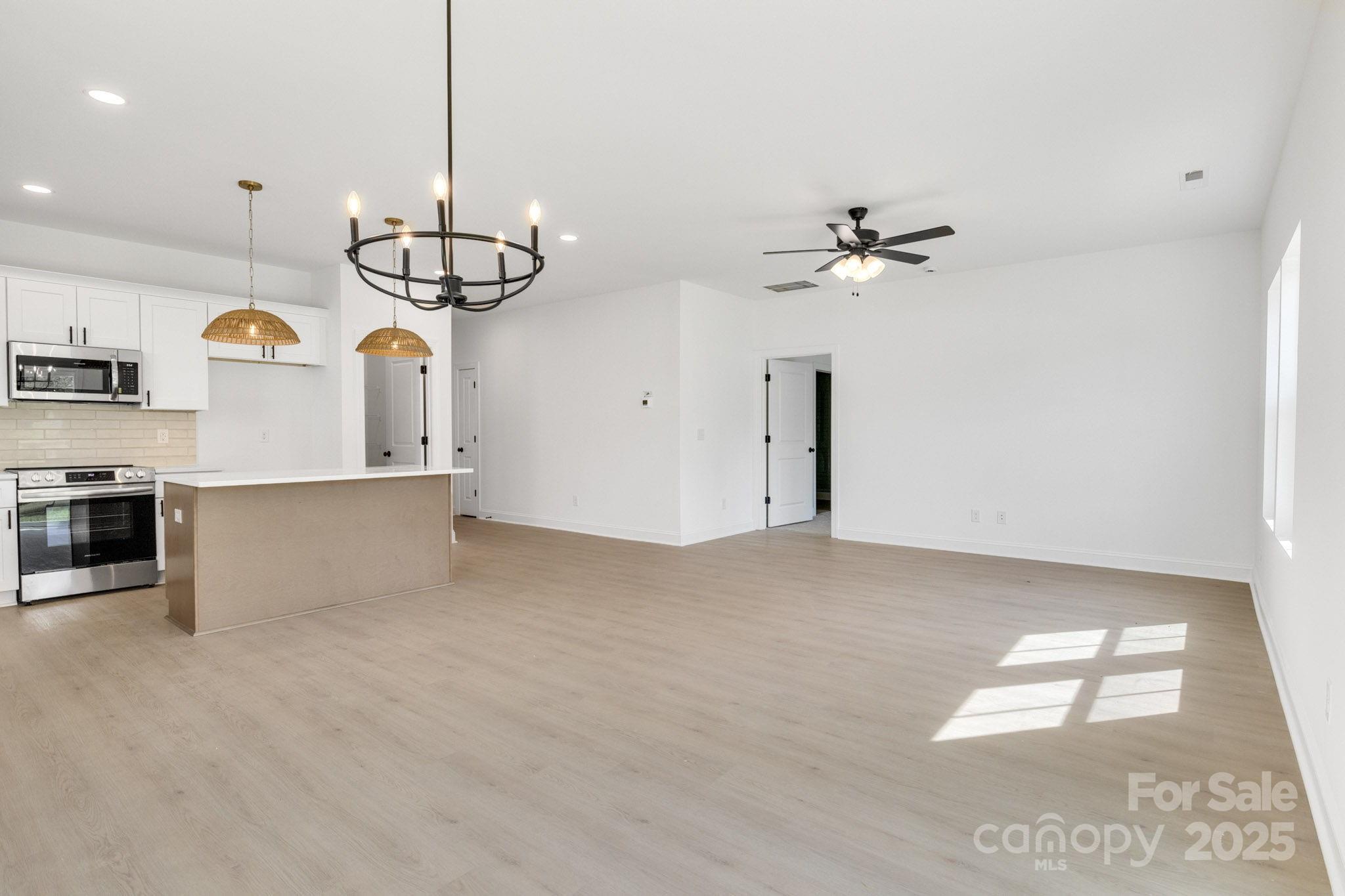 540 Church Street Locust, NC 28097 - Photo 6 of 25 a view of a kitchen with a sink and dishwasher