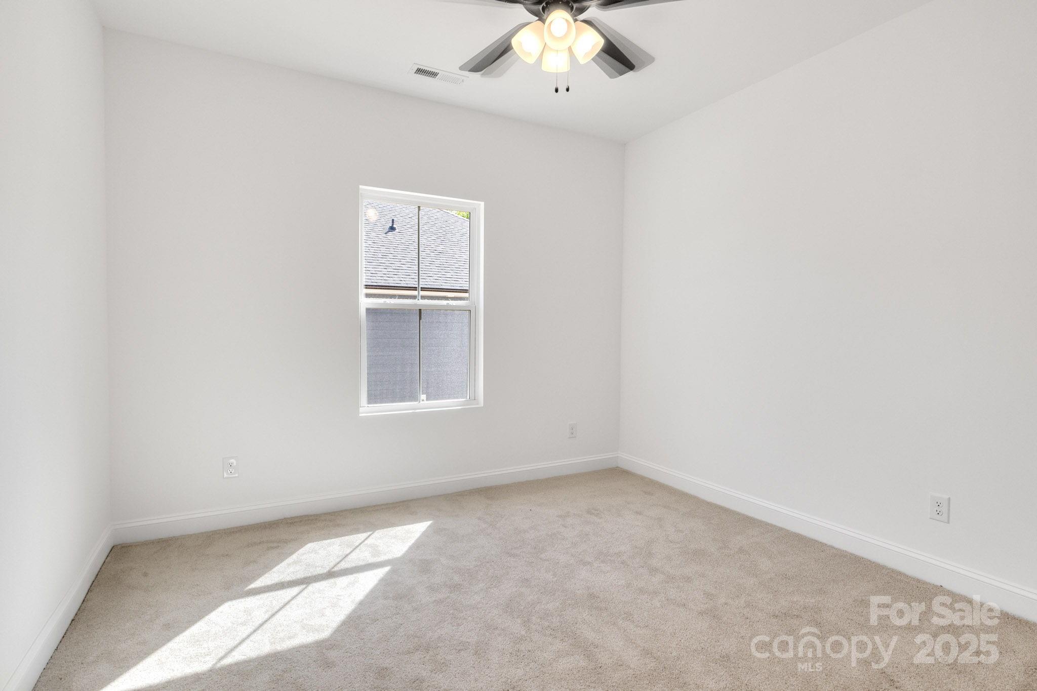 540 Church Street Locust, NC 28097 - Photo 9 of 25 an empty room with a window