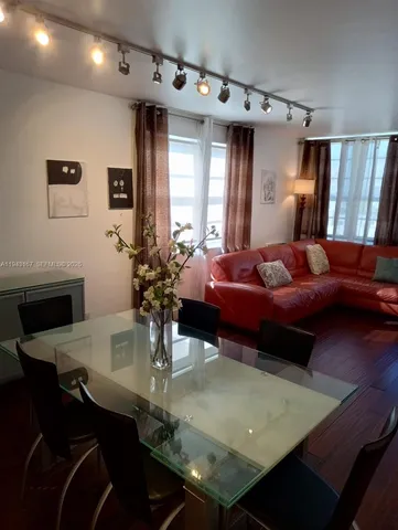 a living room with furniture and a table