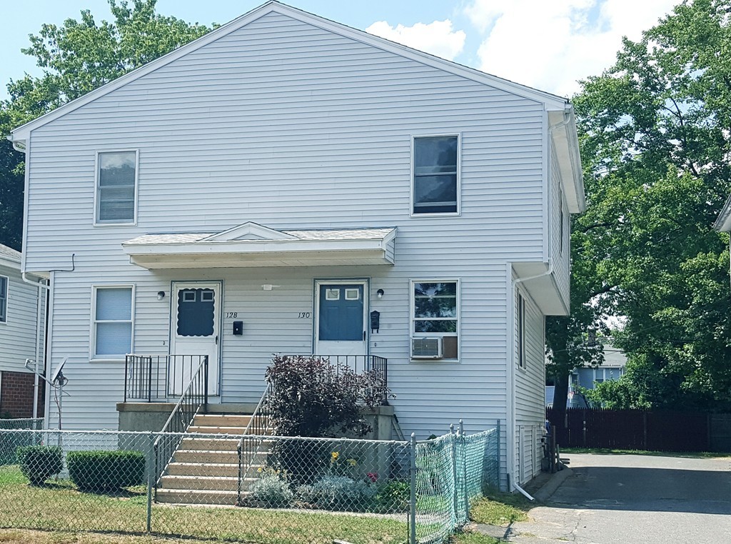 128 Cedar Street Springfield, MA 01105 - Photo 1 of 17 a front view of a house with garden