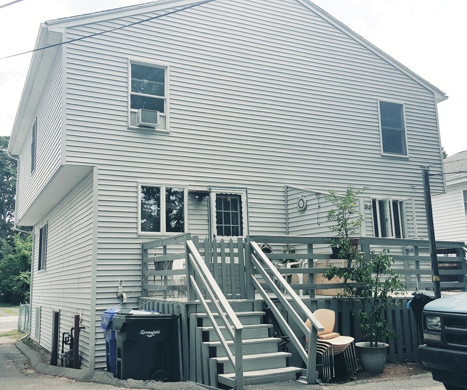 128 Cedar Street Springfield, MA 01105 - Photo 3 of 17 a view of a house with stairs and furniture