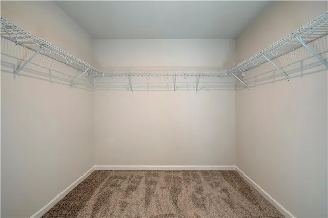 a view of a room with shelf on the wall