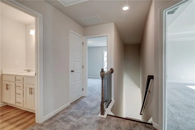 a view of a hallway with a room