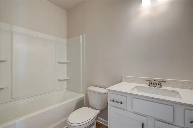 a bathroom with a sink toilet and bathtub