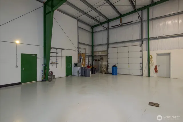 a bathroom with a shower and a sink